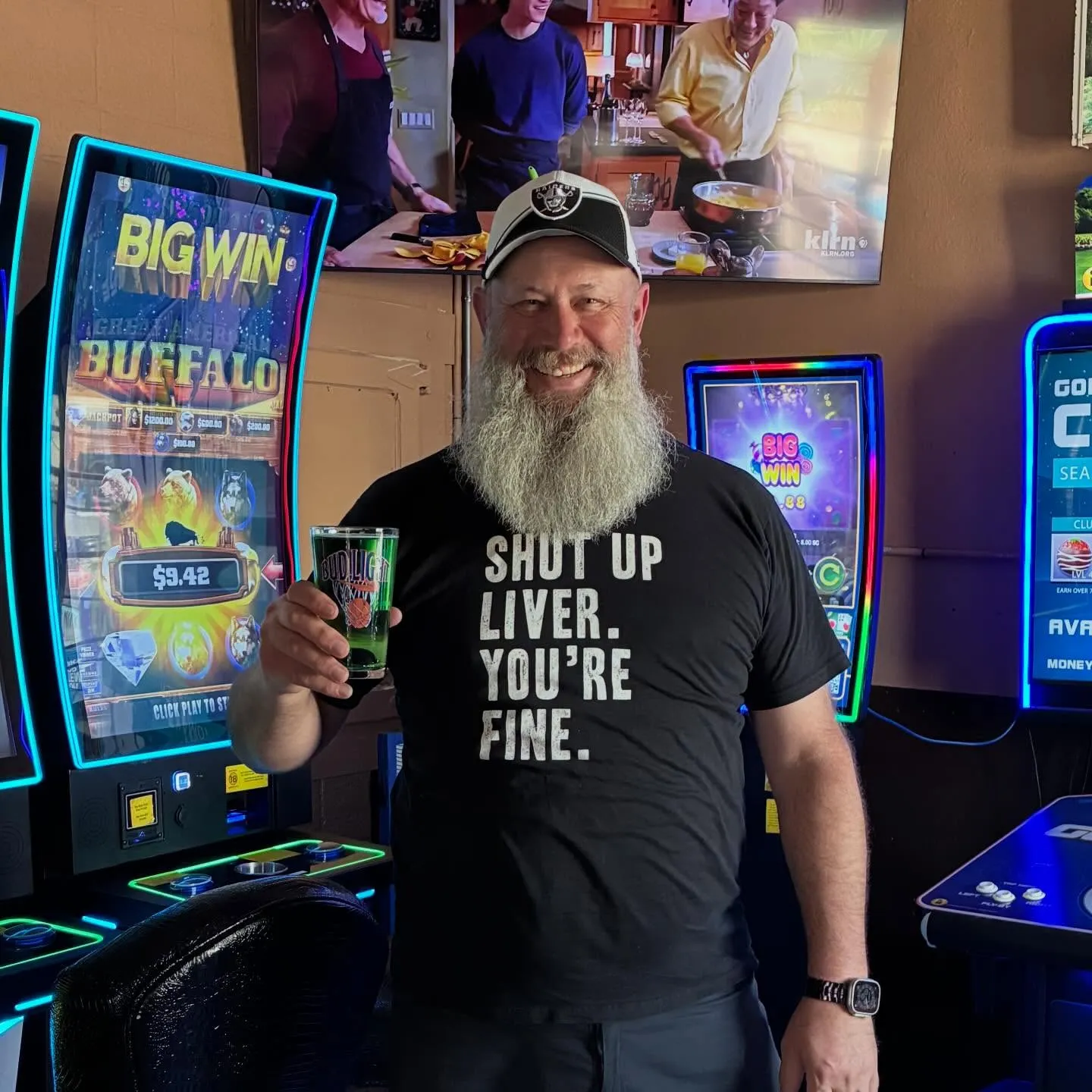 Regular at Bruno's with a beer near the arcade games